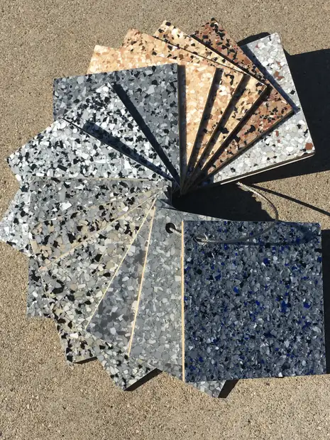 Flake chip sample boards spread out to show the range of gray, blue and earth blends