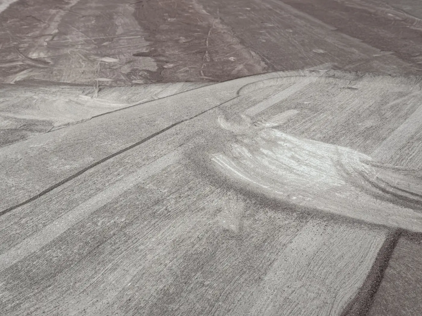 Close view of a ground concrete surface after an old coating was taken off