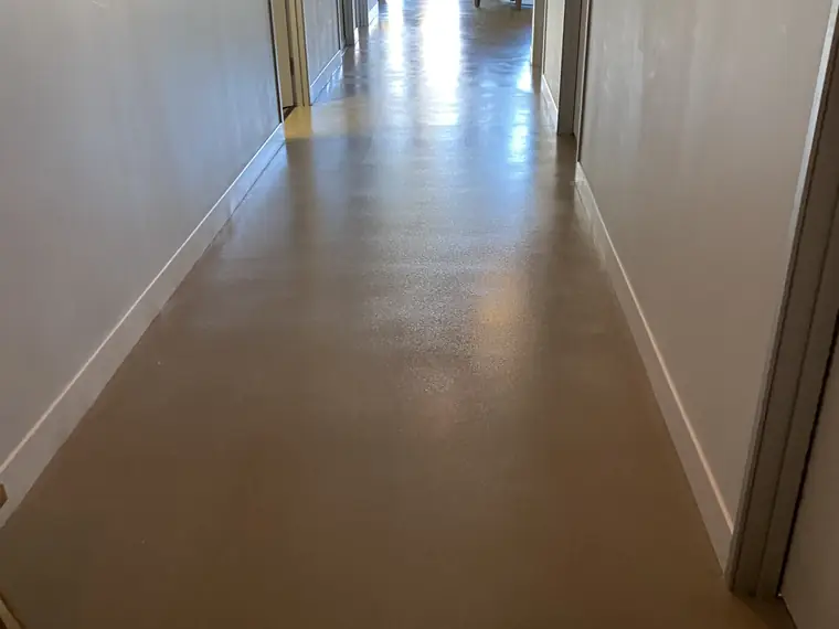Long bronze flake epoxy corridor in a commercial building