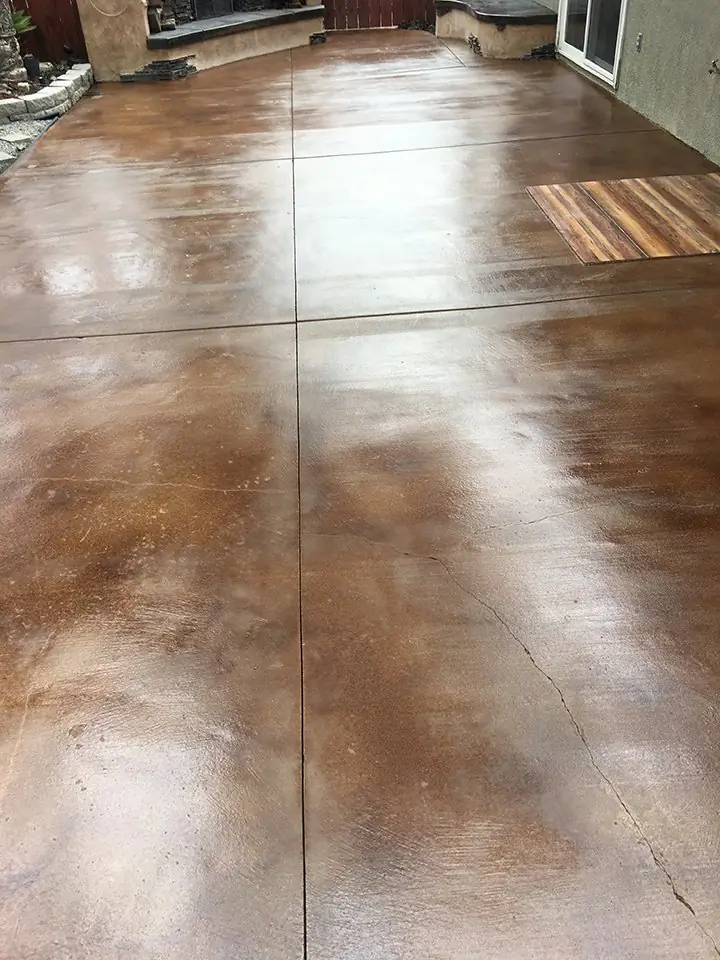 Long brown stained walkway with scored joint lines