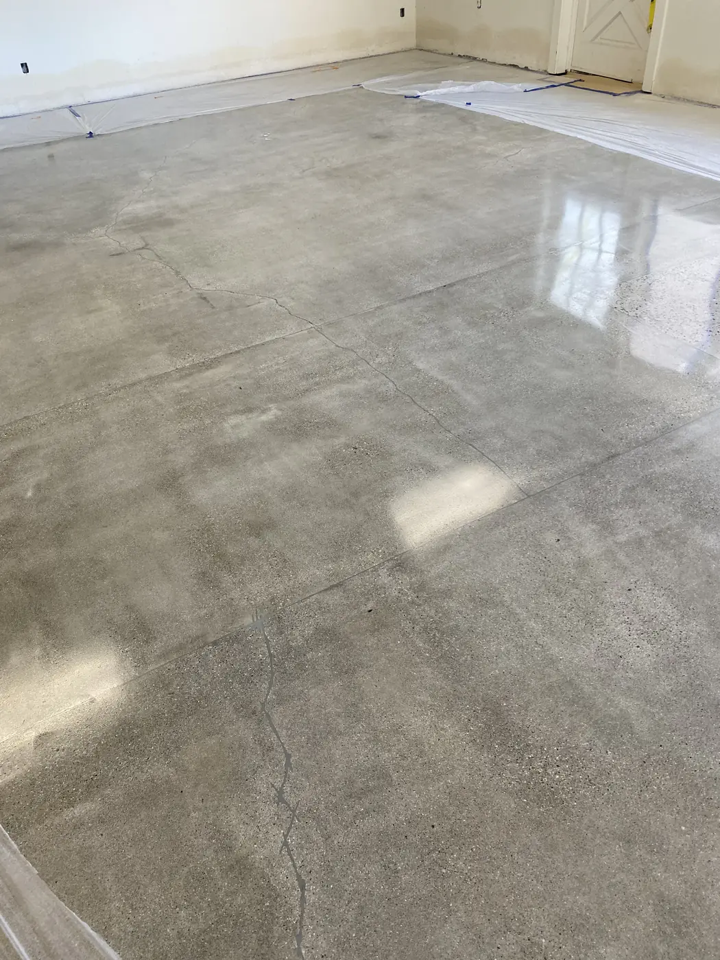 Polished concrete floor reflecting daylight across a large open room